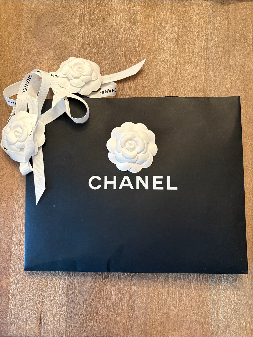 CHANEL Black Shopping Bag with White Camellia Accent ribbons/flowers